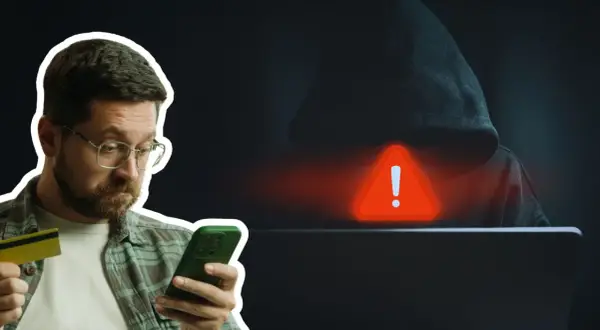 Mężczyzna z kartą kredytową i telefonem, zagrożony przez hakera. Uważaj na kredyt na telefon oszustwa!