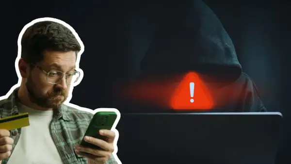 Mężczyzna z kartą kredytową i telefonem, zagrożony przez hakera. Uważaj na kredyt na telefon oszustwa!